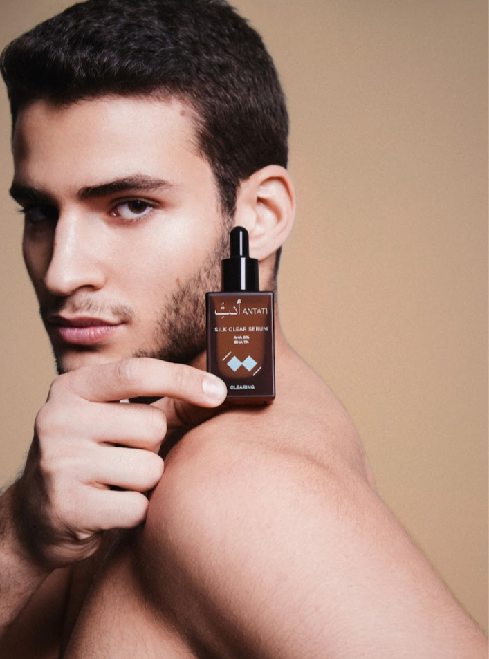 A Man Holding Antati Silk Clear Serum